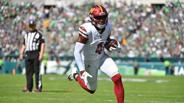 Washington Commanders wide receiver Curtis Samuel (4) scores on a one- yard touchdown run against the Philadelphia Eagles during the first quarter at Lincoln Financial Field.